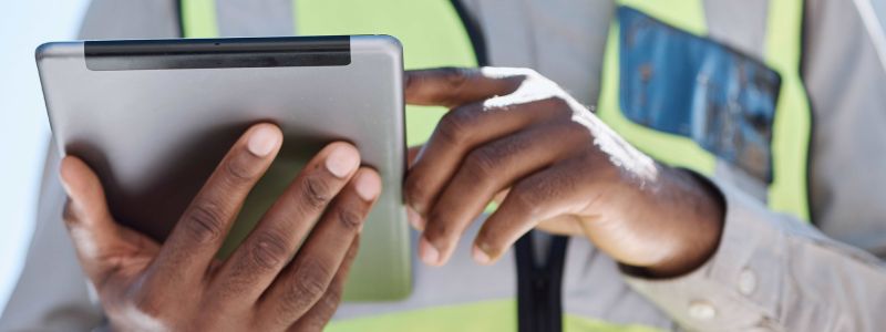 construction worker on tablet