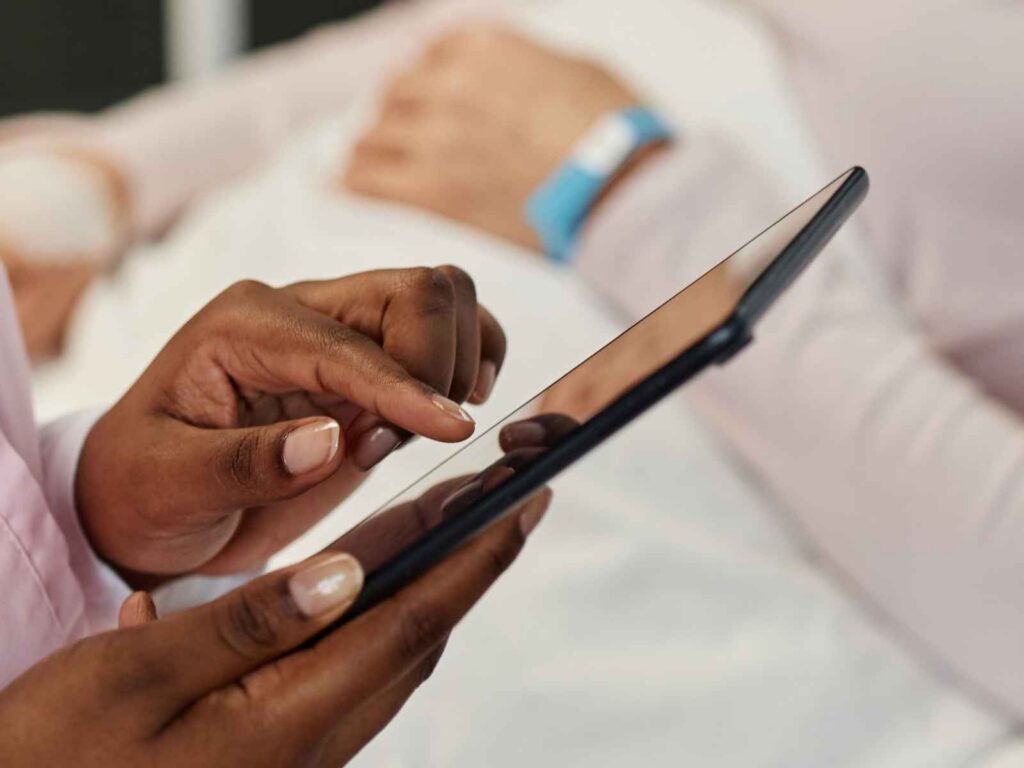 nurse using a tablet