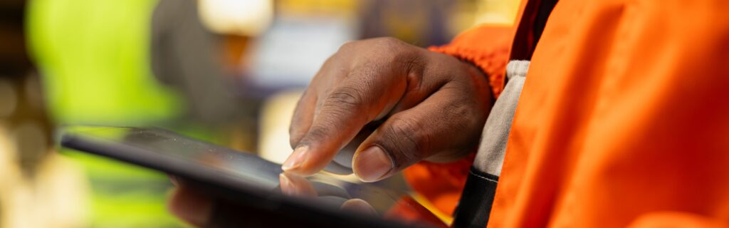 Heading construction worker using a tablet